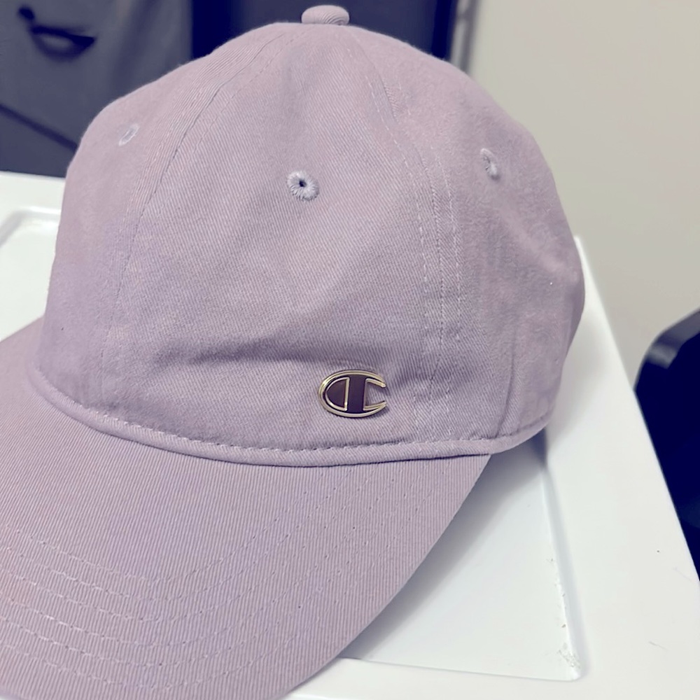 Unisex lavender Original Champion fitted cap with gold pendant logo on the side